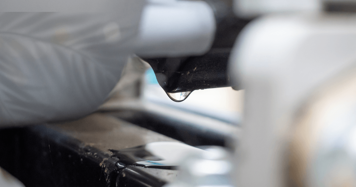 A close-up view of a bottle featuring a single water drop resting on its surface, highlighting the bottle's sleek design.